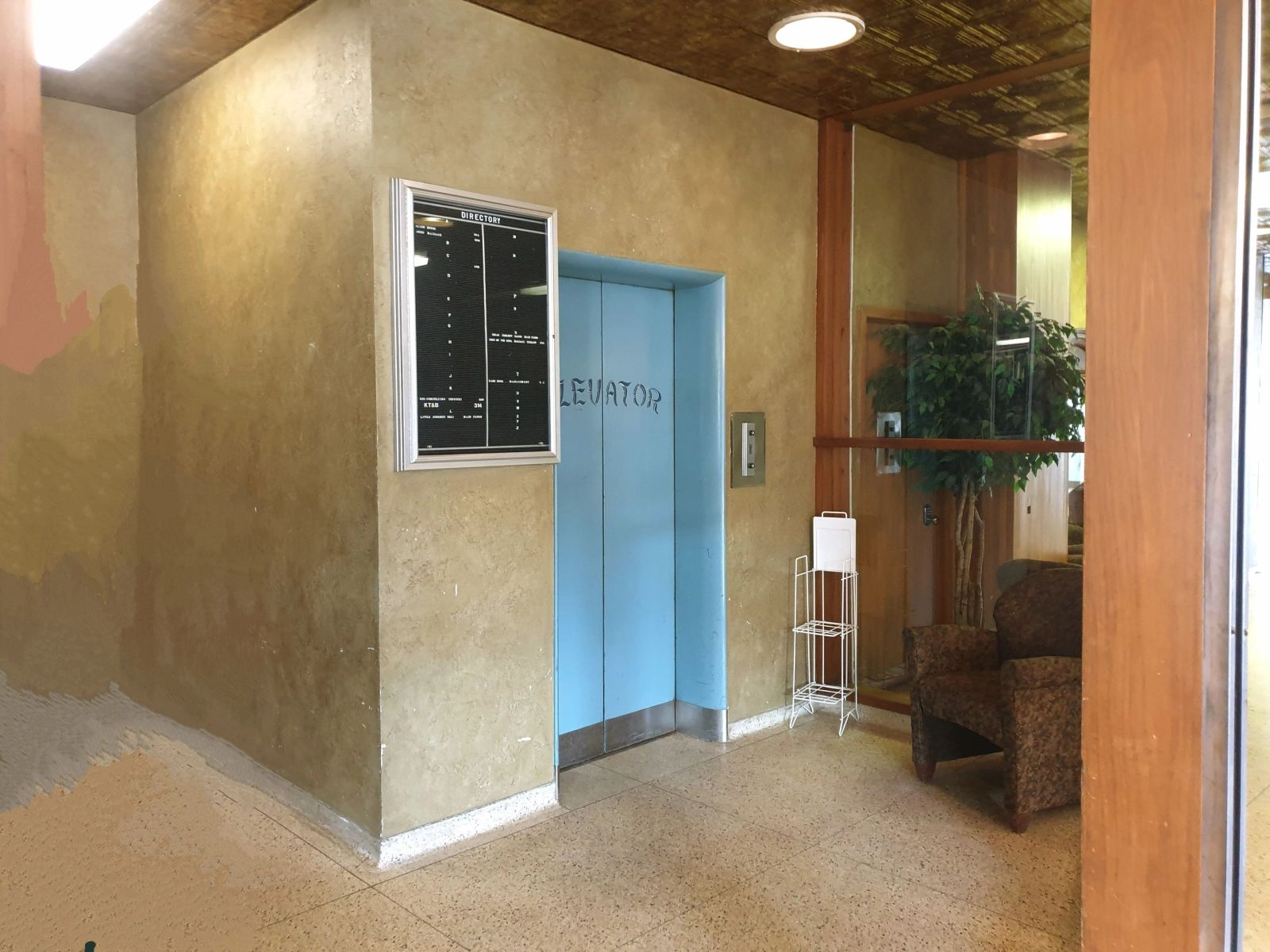 Elevator lobby with pressed-tin ceiling inside the 302 Chestnut building
