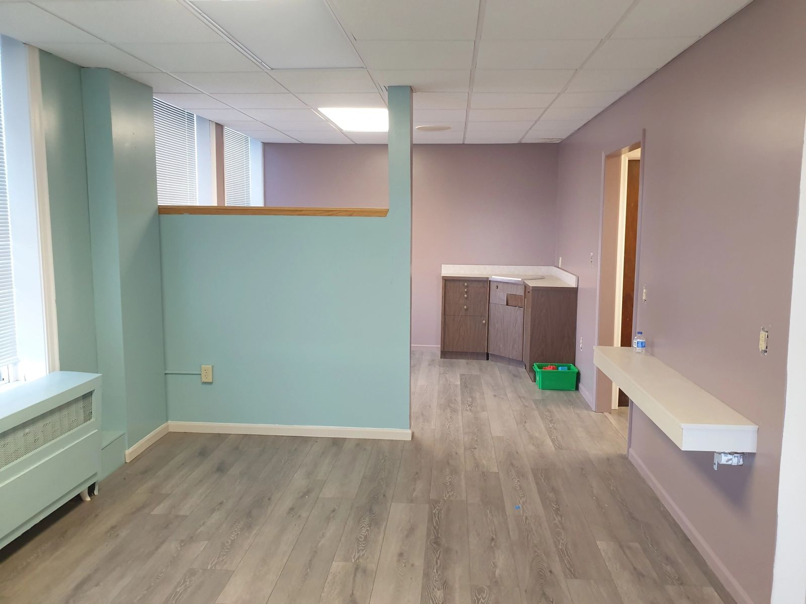 Open office area at 302 Chestnut with new flooring and a built-in counter